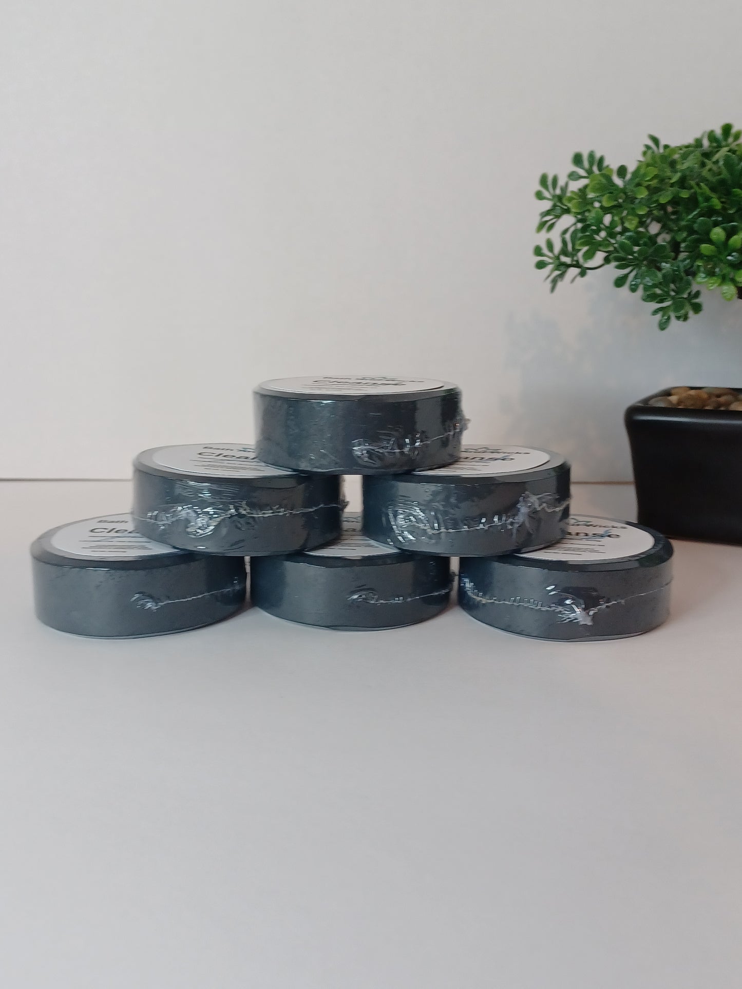Handmade facial bar with activated charcoal, neem seed oil, shea butter, and essential oils to remove impurities and promote clear, healthy skin.